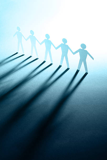 istock figures of man in paper on blue 92269822
