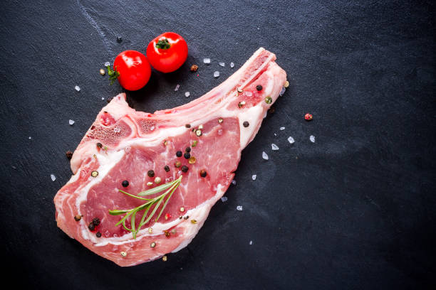 istock Raw veal cutlet at black slate plate 922700682