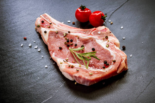 istock Raw veal cutlet at black slate plate 922700694