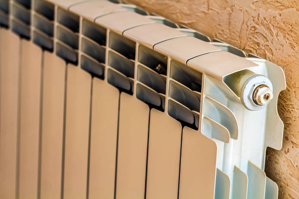 istock White metal heating radiator in new renovated interior 922700728