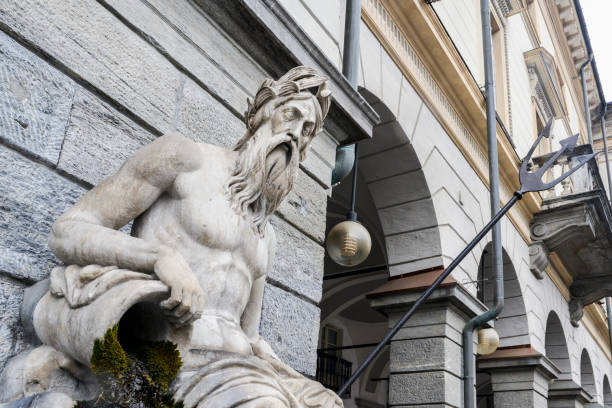 statue von king neptune, gott des süßwassers und das meer in der römischen religion - piazza emile chanoux, aosta, italien - statue roman god neptune men stock-fotos und bilder