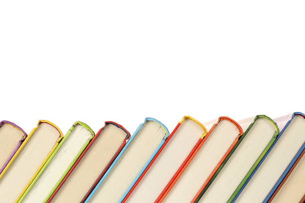 row of books row of colorful and slanted books isolated on white rows of books stock pictures, royalty-free photos & images