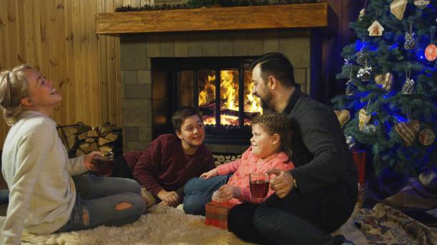 istock Content family at fireplace before Christmas 922703110