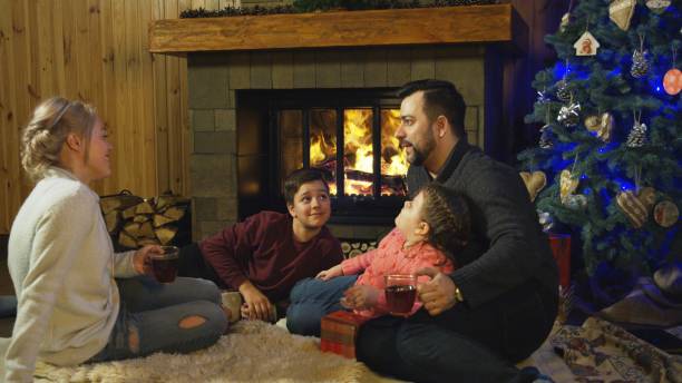 istock Content family at fireplace before Christmas 922703116
