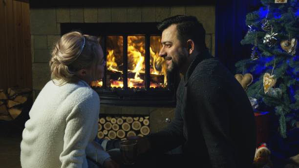 istock Loving couple at fireplace before Christmas 922703130