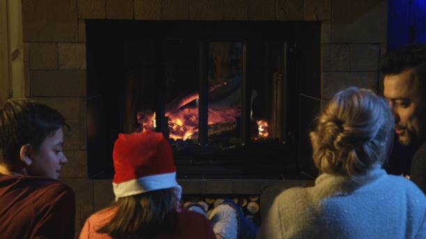 istock Family spending time at fireplace in Christmas 922703188