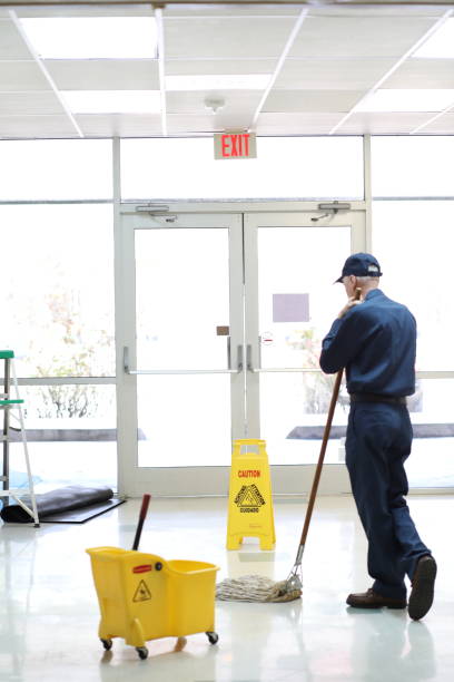 istock Full length image of Senior man working as a janitor in building. 922706620