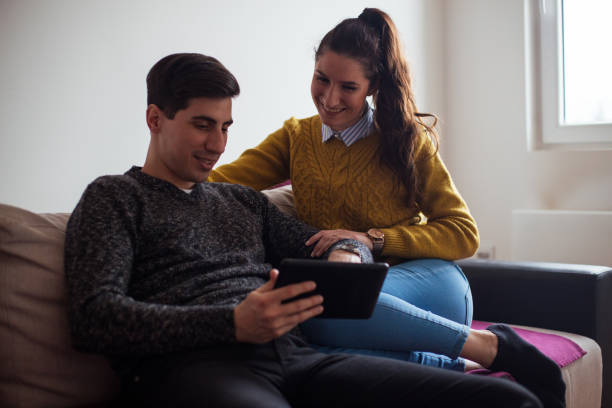 istock A happy couple is having fun in the apartment 922707876