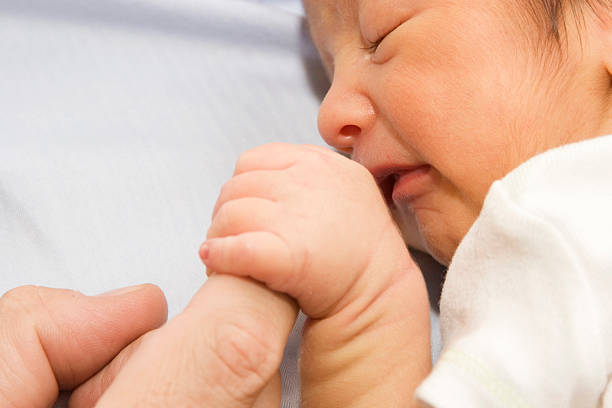 istock Newborn baby and father´s finger 92270809
