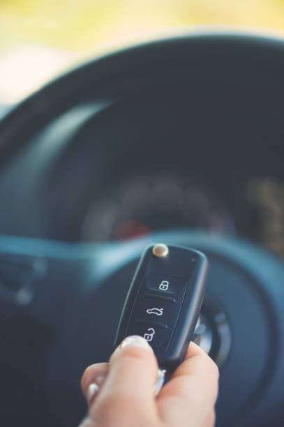 istock Woman holding a car key. 922708298