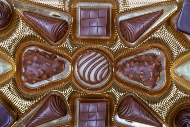 istock A box of chocolates with the golden colored case 922711872