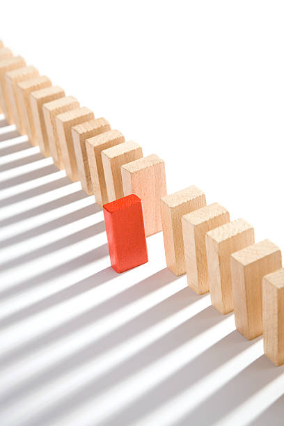 istock Domino effect line with red piece out of place 92271189