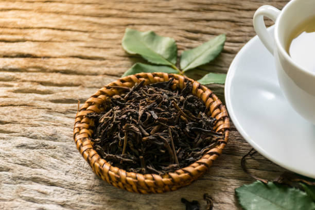 istock hot tea on wooden table 922712520