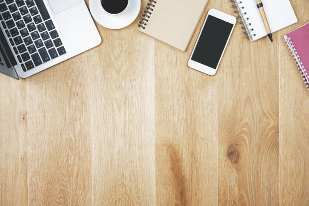 istock Wooden workplace with cellphone and supplies 922713104