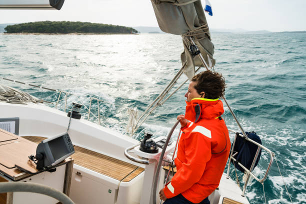 istock Adult Steering Sailing Boat 922713968