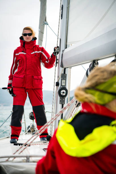 istock Woman Holding a Rope on Sailing Boat Mast 922713974