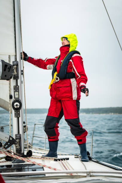 istock Woman Holding Rope on Sailboat Mast 922714062