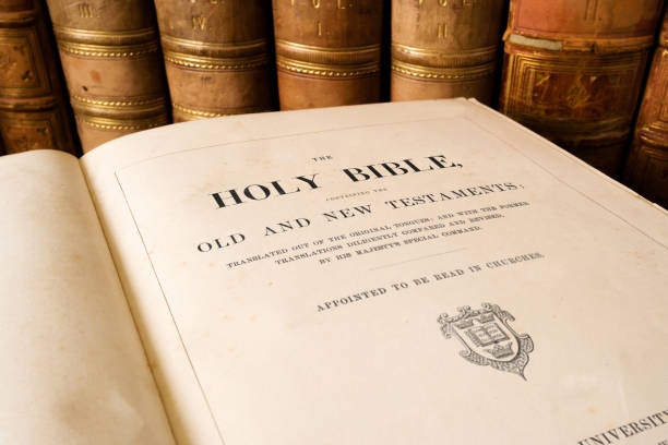 The Antique Holy Bible open at title page The Antique Holy Bible open at title page new testament stock pictures, royalty-free photos & images