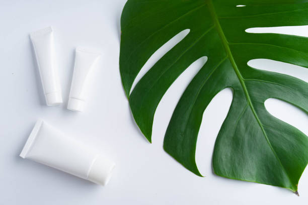 istock Beautiful natural cosmetics and leaves on light background 922716878