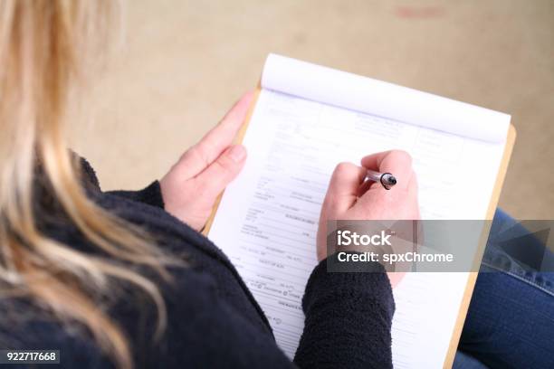 Filling Out Patient Information Form Stock Photo - Download Image Now - Patient, Form Filling, Form - Document