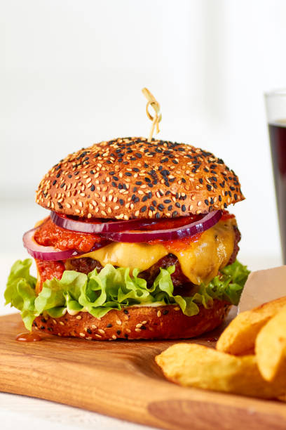 istock Classic cheeseburger on wooden board 922719454