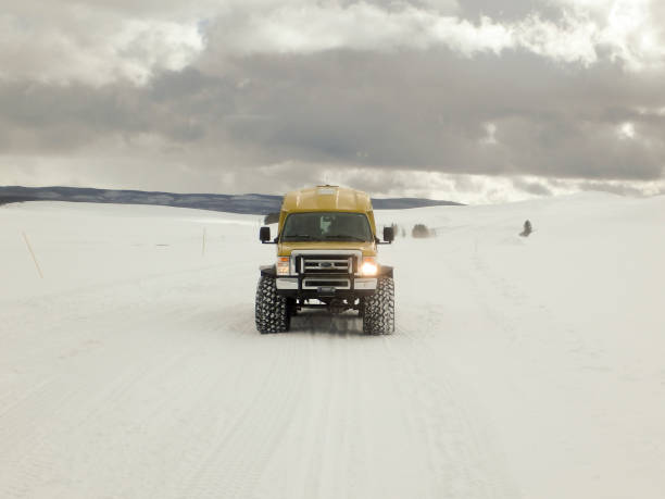 istock Snow coach in Yellowstone National Park in winter. 922720142