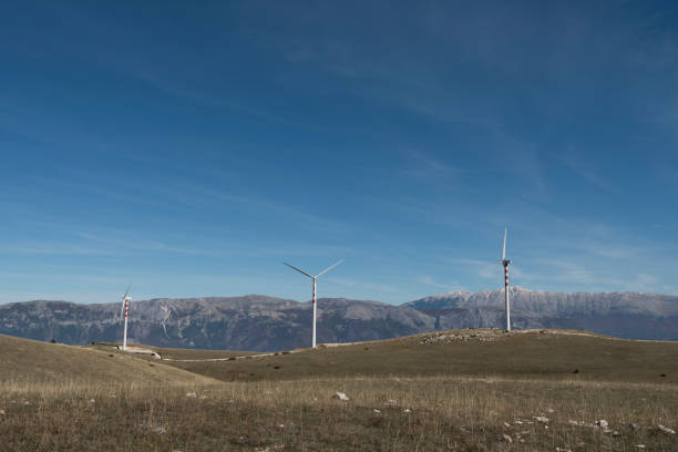 istock wind powered turbines on a mountain landscape 922720710
