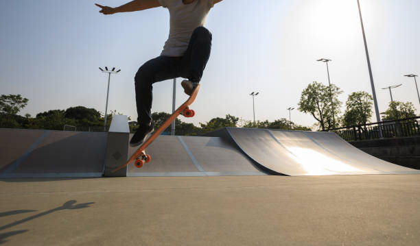 istock skateboarder legs skateboarding on skatepark 922721878