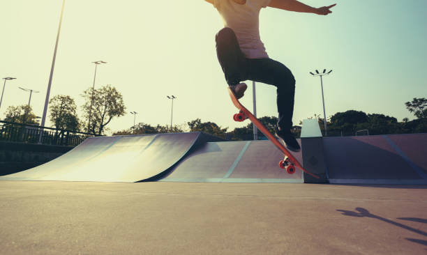 istock skateboarder legs skateboarding on skatepark 922722378