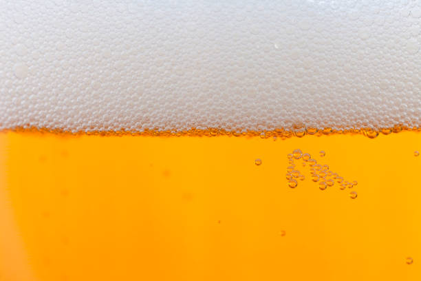 istock Jug of blonde beer with white foam 922723624