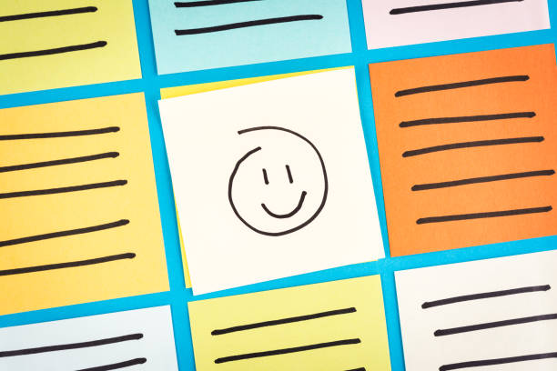Happy emoticon on news board concept.