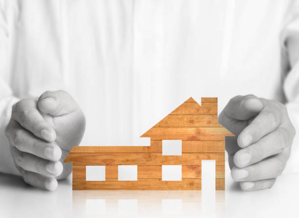 istock Mortgage concept by house from  hand 922725654