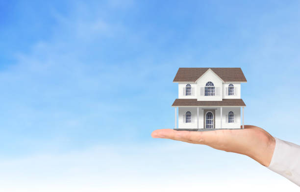 istock Mortgage concept by house from  hand 922725660