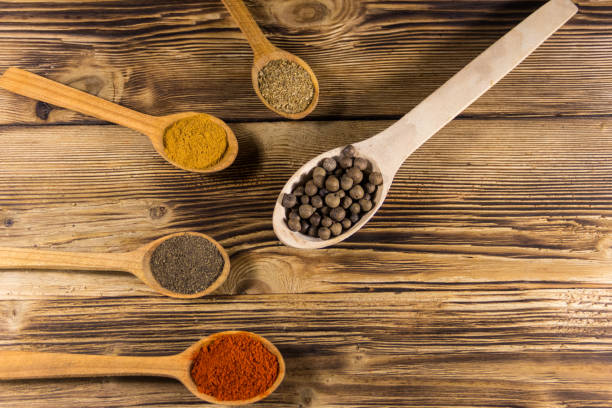 istock Assorted spices in wooden spoons on a table 922727512
