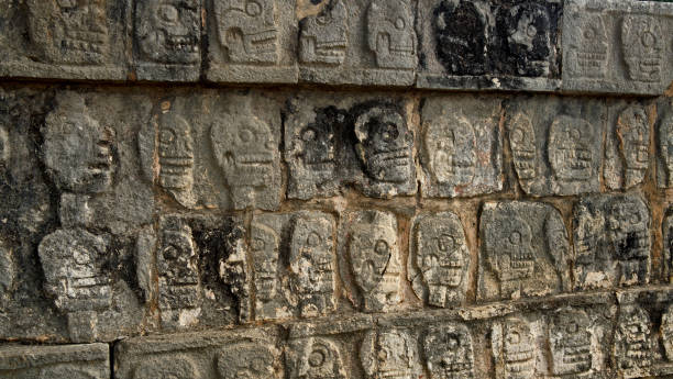 istock scull carvings on a stone wall at Chichen Itza 922728864