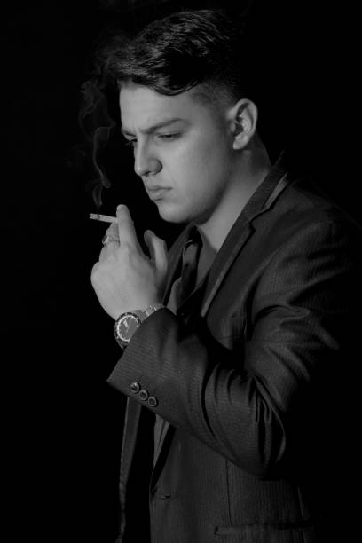 istock Young Man Portrait Smoking a Cigarrete 922734248