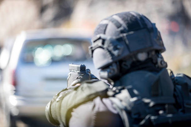 istock Swat Police Officer Shooting With Firearm 922735272