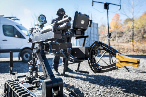 Police Swat Officer Using a Mechanical Arm Bomb Disposal Robot Unit