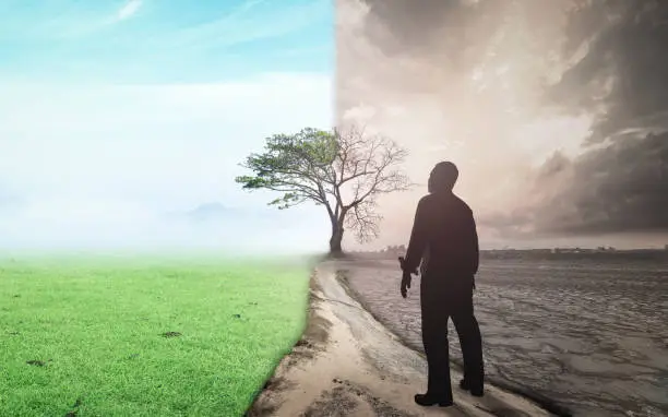 Business man standing between climate worsened with good atmosphere