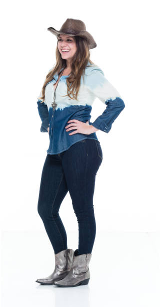 istock Lovely cowgirl with hands on hips 922735974