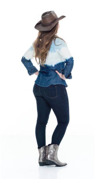 istock Lovely cowgirl with hands on hips 922736168