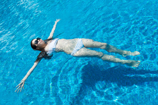 Beautiful women playing in the pool