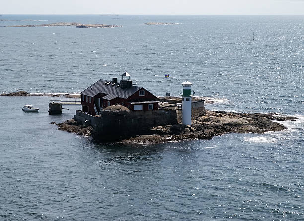 istock Small island with lighthouse near Swedish coast 92273705