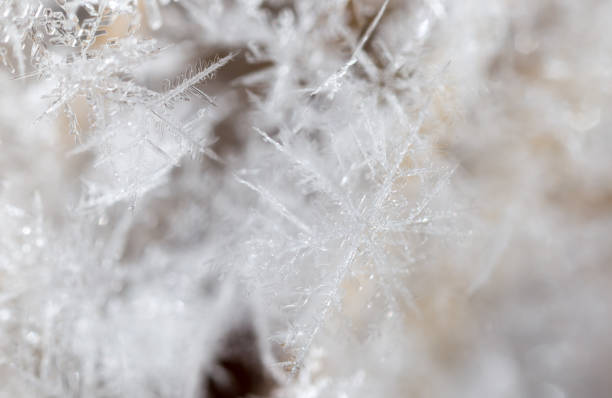 istock Small snowflakes on nature as background 922741082