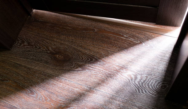 istock Rays of light from the door in a dark room 922741140