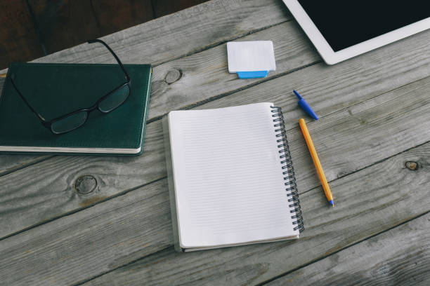 istock Home workspace concept. Notepad with pen on wooden home office desk 922742368