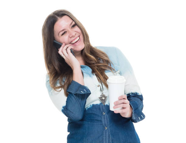 istock Cute female in blue outfit using mobile phone 922743322