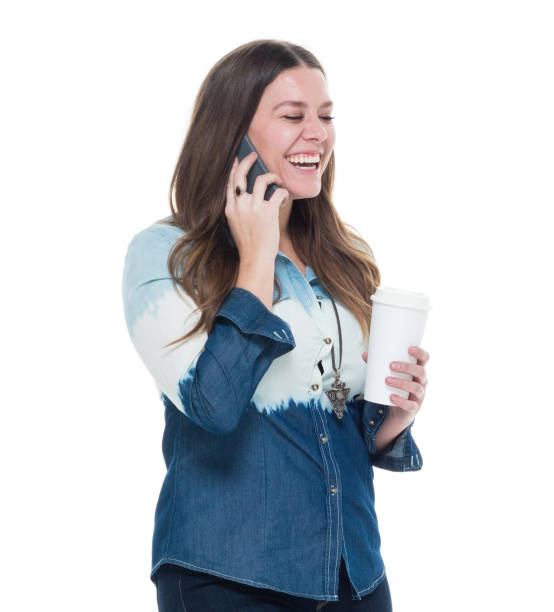 istock Cute female in blue outfit using mobile phone 922743424
