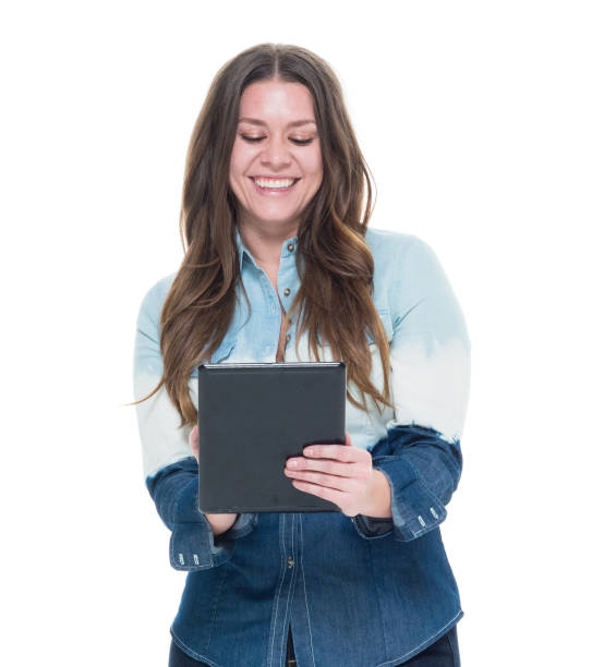 istock Cute female in blue outfit holding a tablet 922743982