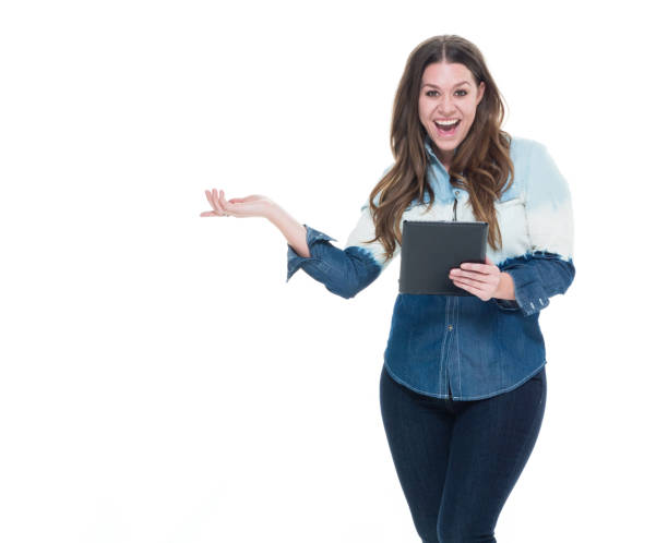 istock Cute female in blue outfit holding a tablet 922744028